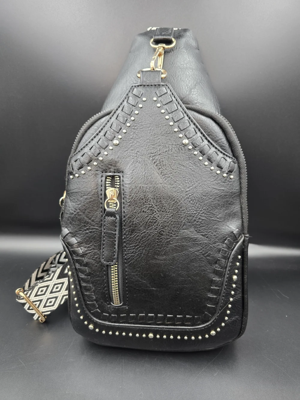 Black Studded Women's Leather Sling Backpack with Patterned Strap